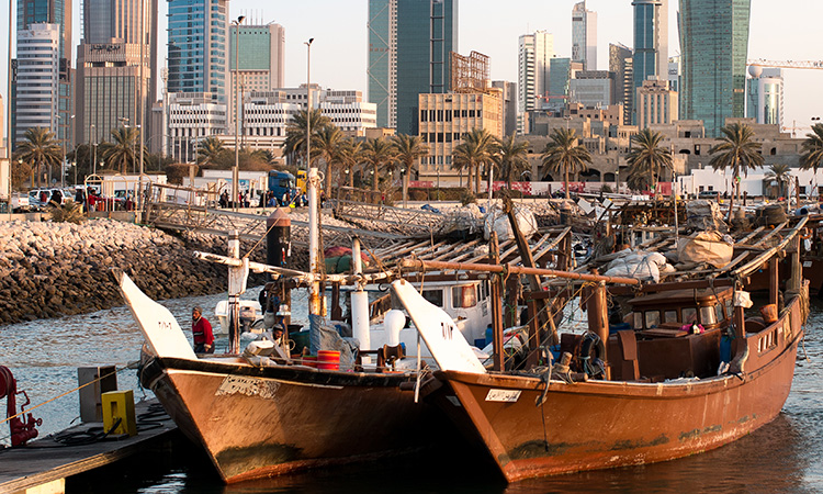 Arabic,Traditional,Wooden,Dhows,In,Front,Of,Kuwait,Skyscrapers,In