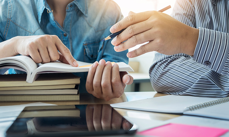 Young,Students,Campus,Helps,Friend,Catching,Up,And,Learning,Tutoring.