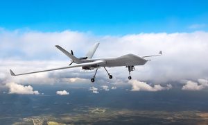Patrolling,Unmanned,Aircraft,In,The,Sky,Above,The,Terrain,,Fly