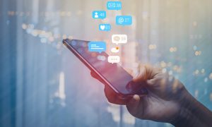 Person,Using,A,Social,Media,Marketing,Concept,On,Mobile,Phone
