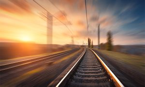Railroad,In,Motion,At,Sunset.,Railway,Station,With,Motion,Blur