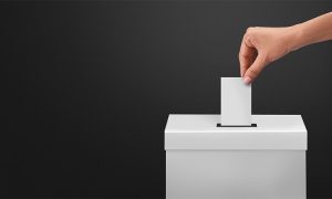 Female,Or,Women,Voter,Holds,Envelope,In,Her,Hand,Above