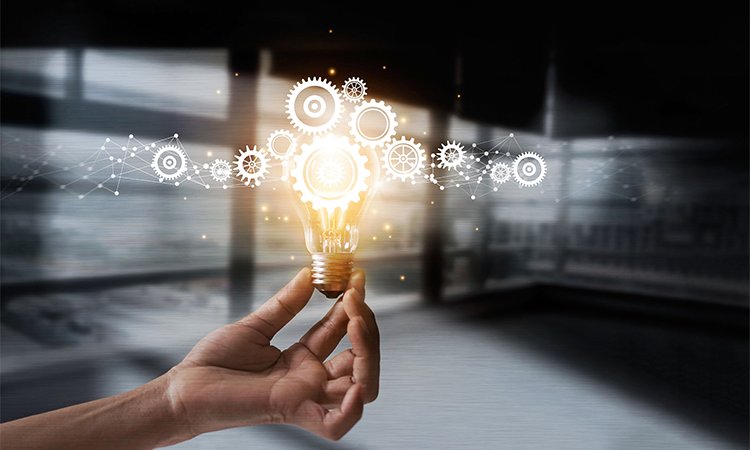 Hand,Holding,Light,Bulb,And,Cog,Inside.,Idea,And,Imagination.