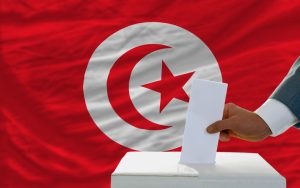 Man,Putting,Ballot,In,A,Box,During,Elections,In,Tunisia