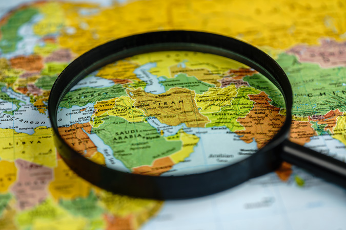 Map,Of,Europe,,Magnifying,Glass,Directed,On,Iran