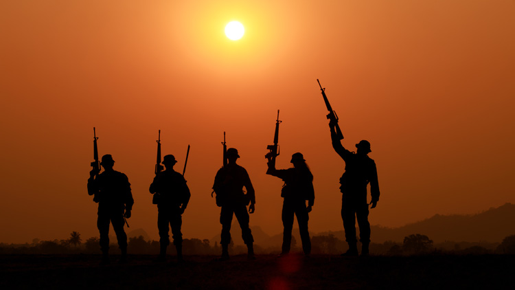 Silhouette,Of,Military,Soldier,Or,Officer,With,Weapons,At,Sunset.
