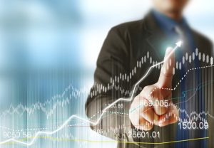 Businessman,With,Financial,Symbols,Coming