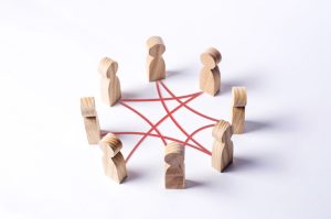 Circle,Of,People,Interconnected,By,Red,Curves,Lines.,Cooperation,,Teamwork,