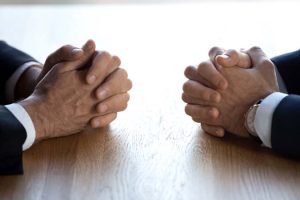 Clasped,Hands,Of,Two,Business,Men,Negotiators,Opponents,Opposite,On
