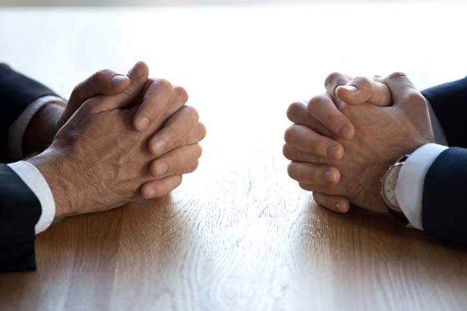 Clasped,Hands,Of,Two,Business,Men,Negotiators,Opponents,Opposite,On