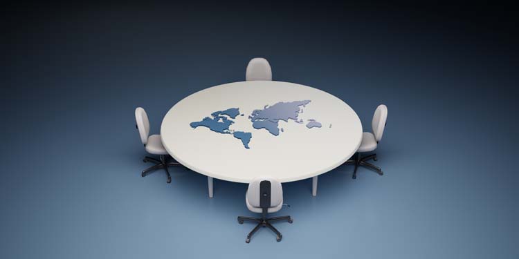 Conference table and chairs with the world map on the board. International politics concept,