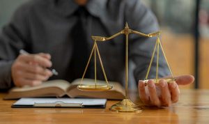 A,Lawyer,Is,Trying,His,Hand,Under,The,Scales,Of