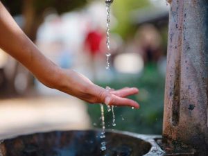 Antalyas old town: female hand and water