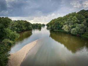 The Loire rivers next Tours, summer view with clouds and green foliages, Loire valley, France