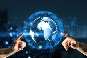 Close,Up,Of,Hands,Pointing,At,Glowing,Globe,Hologram,On