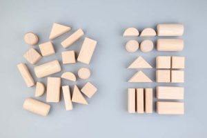 Many,Different,Geometric,Wooden,Toys,In,Confused,Positions,On,The