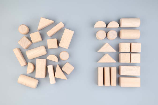 Many,Different,Geometric,Wooden,Toys,In,Confused,Positions,On,The