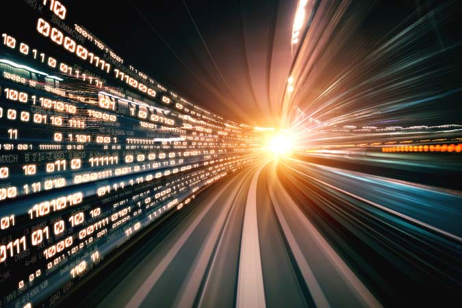 Digital,Data,Flow,On,Road,With,Motion,Blur,To,Create
