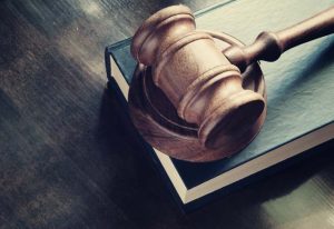 Judge,Gavel,And,Legal,Book,On,Wooden,Table,,Justice,And