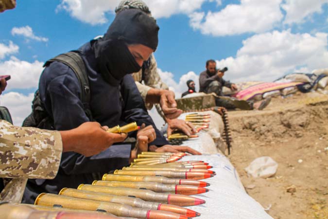 A,Soldier,In,An,Isis,Uniform,Prepares,Ammunition.,The,War