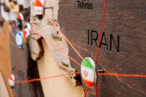 Iran,Flag,On,The,Pushpin,With,Red,Thread,Showed,The