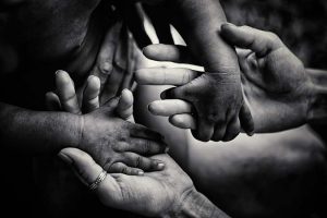 Helping,Children.,Volunteer.,Adult,Holding,Smal,Hands,Of,Little,African